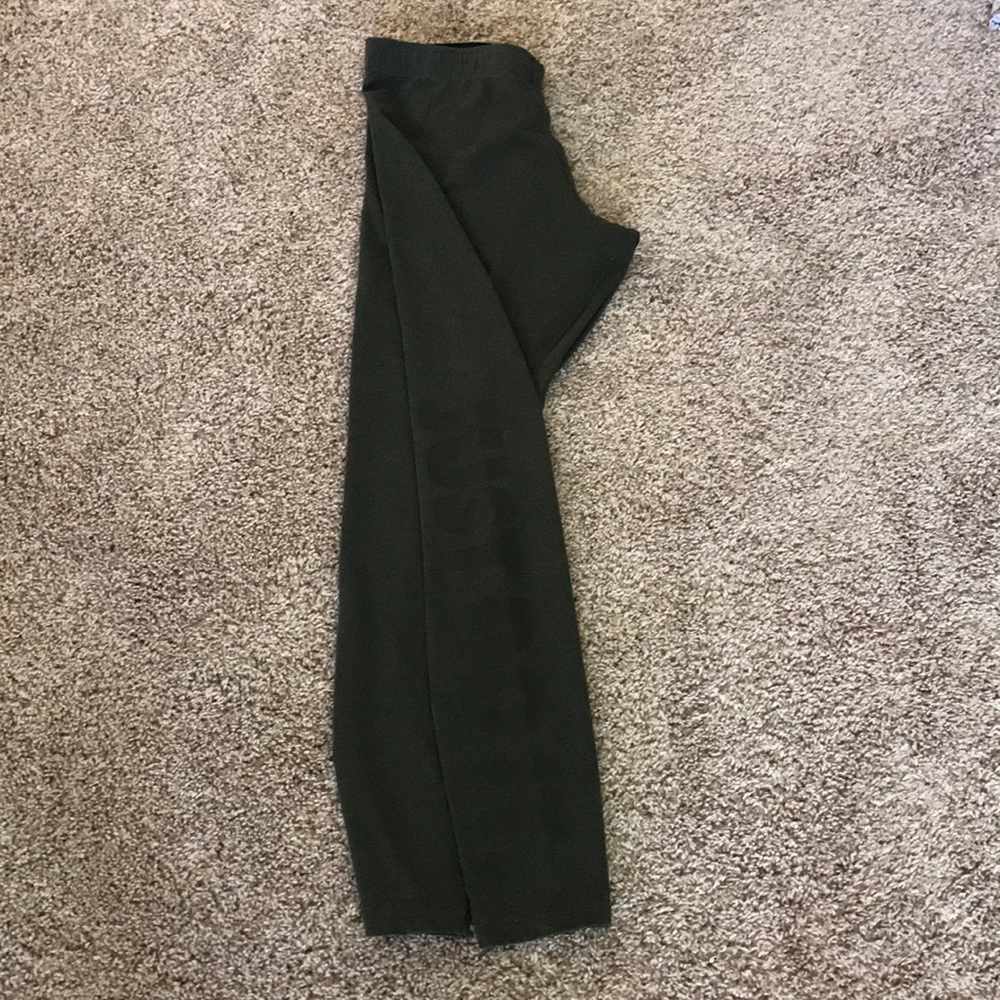 Olive green Nike leggings with “Just Do It”